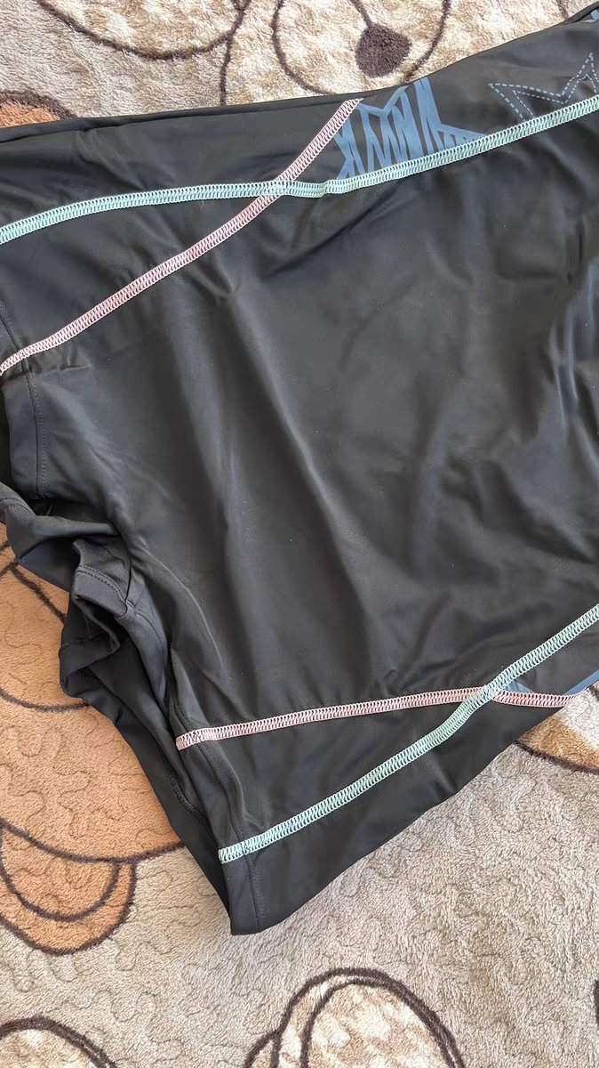 abely short sleeve boyleg colorblock women swimsuit flatlay front abely short sleeve boyleg colorblock women swimsuit flatlay front