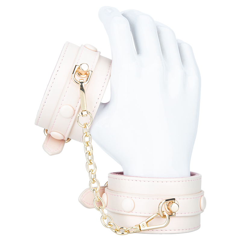 Imbracatura regolabile in pelle PU foderata in peluche rosa crema con set di manette con grillo